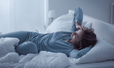 depressed woman waking up, in bed